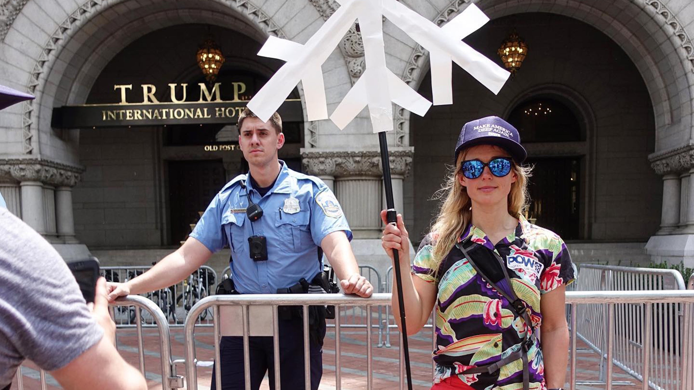 Caroline Gleich, professional ski mountaineer, protests outside of Trump International Hotel.