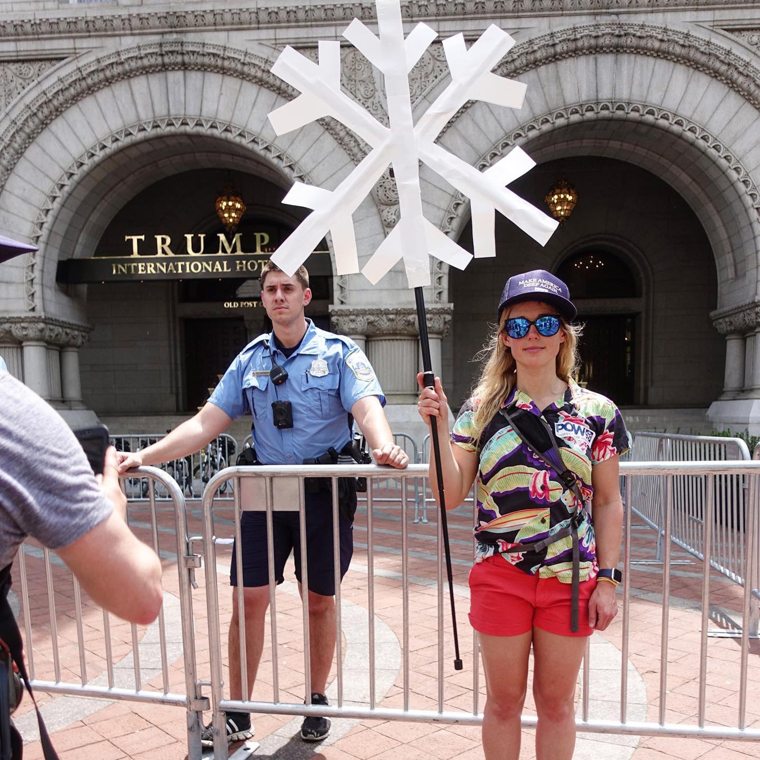 Caroline Gleich, professional ski mountaineer, protests outside of Trump International Hotel.