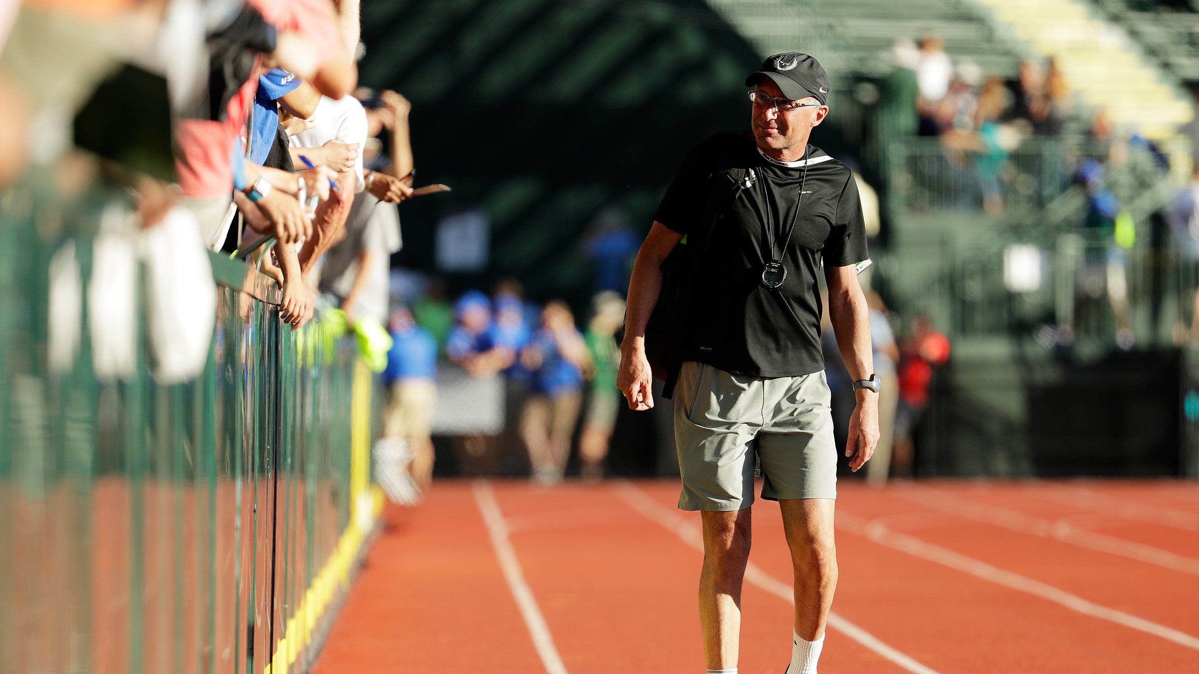 Coach Alberto Salazar looks on as Galen Rupp celebrates during the 2016 U.S. Olympic Track and Field Team Trials.