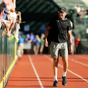 Coach Alberto Salazar looks on as Galen Rupp celebrates during the 2016 U.S. Olympic Track and Field Team Trials.