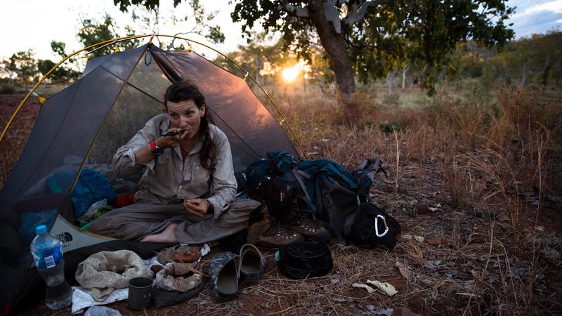 In Australia, eating roasted boab nuts smashed between two rocks at the end of the day