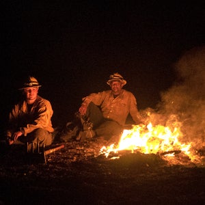 Firefighters take a break after working night operations during the Donnell Fire in Stanislaus National Forest, California.