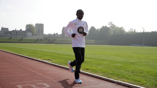 Eliud Kipchoge crosses the finish line at the Iffley Road Track in Oxford, England, where Roger Bannister broke the four minute mile barrier in 1954.
