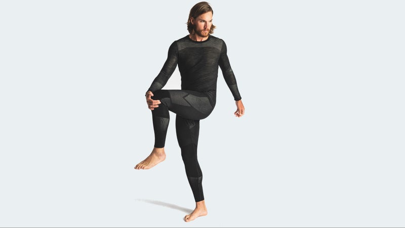 It’s essentially the 200-weight merino fabric you’re used to, combined with more open, ventilating sections (the gray). There are no seams between the two areas.