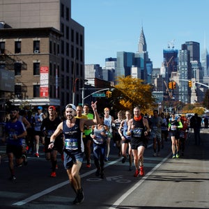 Runners jog through Queens during the 2018 New York City Marathon.