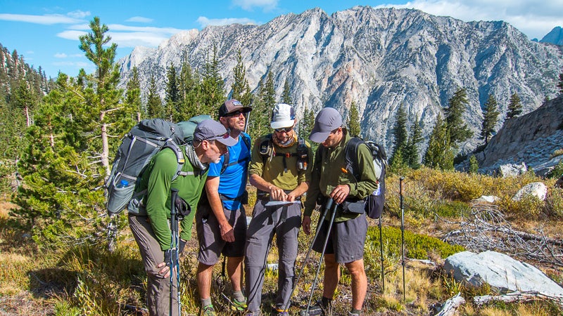 Backcountry guide Dave Eitemiller (second from right) and his crew get their bearings before committing to a big climb up 国产吃瓜黑料r Col on California鈥檚 Kings Canyon High Basin Route.