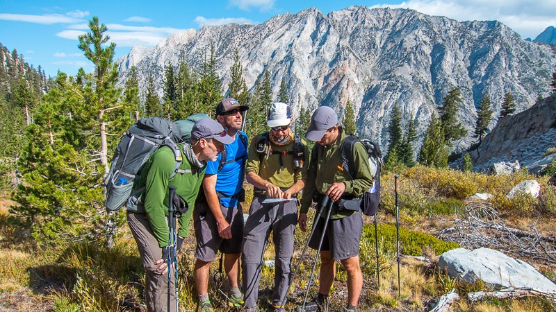 Backcountry guide Dave Eitemiller (second from right) and his crew get their bearings before committing to a big climb up ϳԹr Col on California’s Kings Canyon High Basin Route.