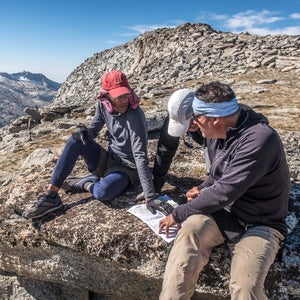 From a high point above Tablelands in Sequoia and Kings Canyon National Parks, legendary thru-hiker and guide Brian Robinson (left) discusses the proposed route with members of his group.