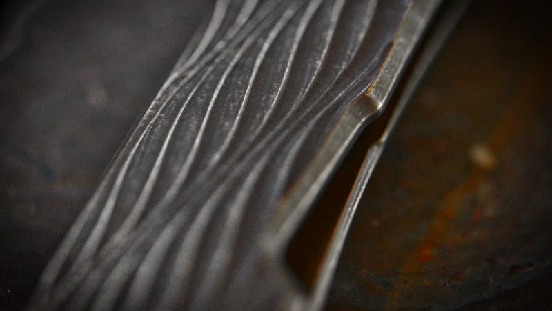 The organic curves of the handle contrast the strength of the materials and construction.