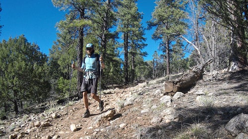 Garmire calls himself a thru-hiker, but he operates at the speed of an Olympian, gracefully running over scree fields and ice chutes, breaking records and accomplishing feats few others can claim.