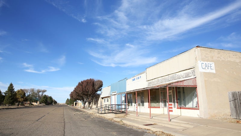 Some shops in Roy sitting vacant under the clear blue New Mexican sky. Most places in town are closed on Sundays.