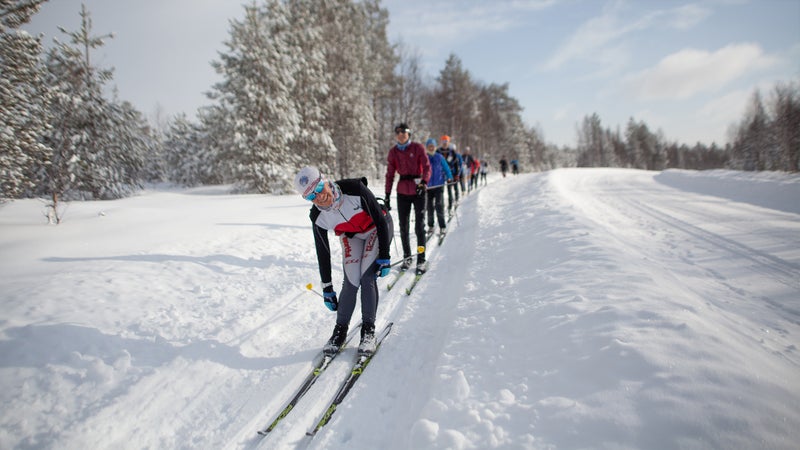 A group skiing near the Virkkula service point in Kuusamo, Finland
