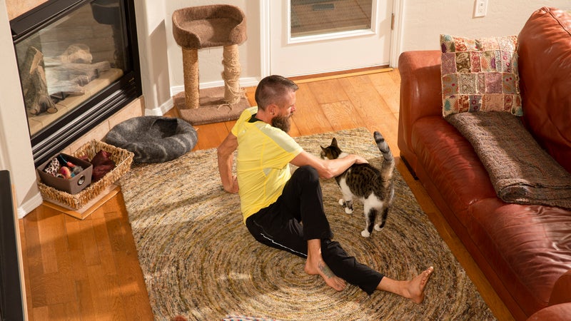 At home, with one of his rescue cats