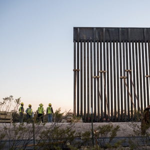 Construction workers at the San Bernardino wildlife refuge border wall site