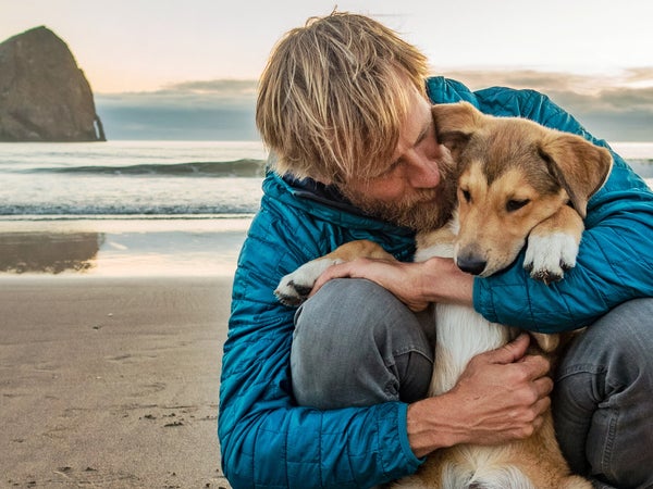 Ben Moon and his new dog, Nori, bond on the beach where the author and Denali spent Denali's final days.