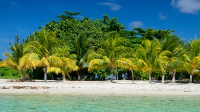 An idyllic beach at Hunting Caye in the Sapodilla Cayes Marine Reserve.