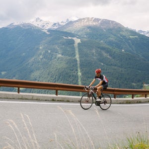 Cyclist On A Mountain Road
