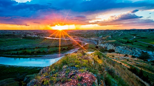 Sunrise over the terrain at North Dakota's Theodore Roosevelt National Park.
