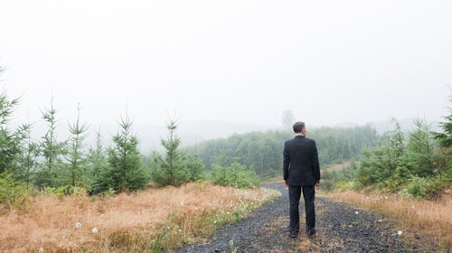 Unrecognizable Businessman In Nature Landscape