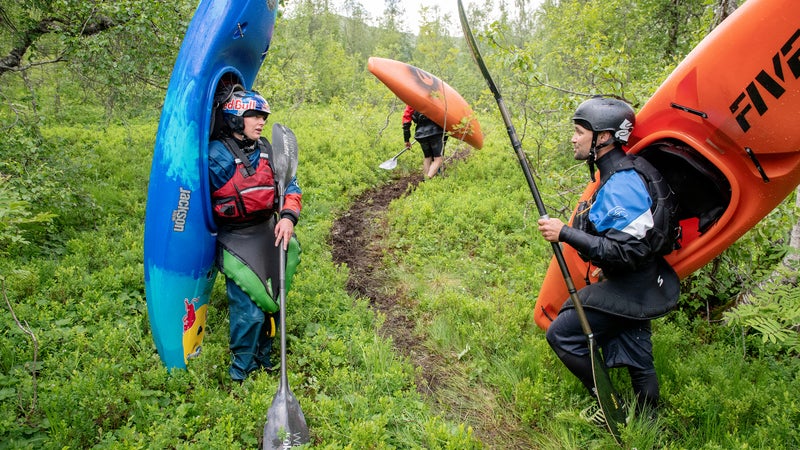 Newman (left) discussing lines with a fellow kayaker in Norway