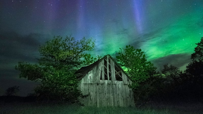 It's important to maintain consistent lighting on the foreground when photographing the aurora. Peter set up a single dimmable LED on a light stand about 60 feet away. | Camera: Olympus OM-D E-M1 Mark II | Lens: M.Zuiko Digital ED 7-14mm F2.8 PRO | Settings: ISO1600, f/2.8, 8s @ f/2.8