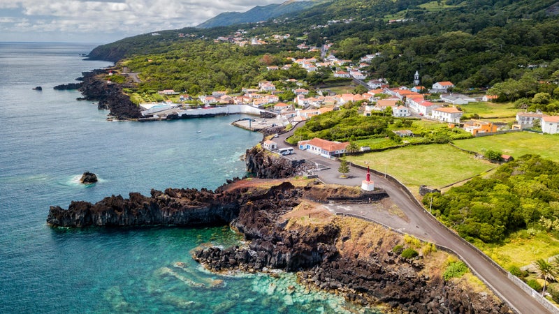 Aerial shot of the beautiful blue waters next to Canada de Africa on Sao Jorge, Azores, Portugal.