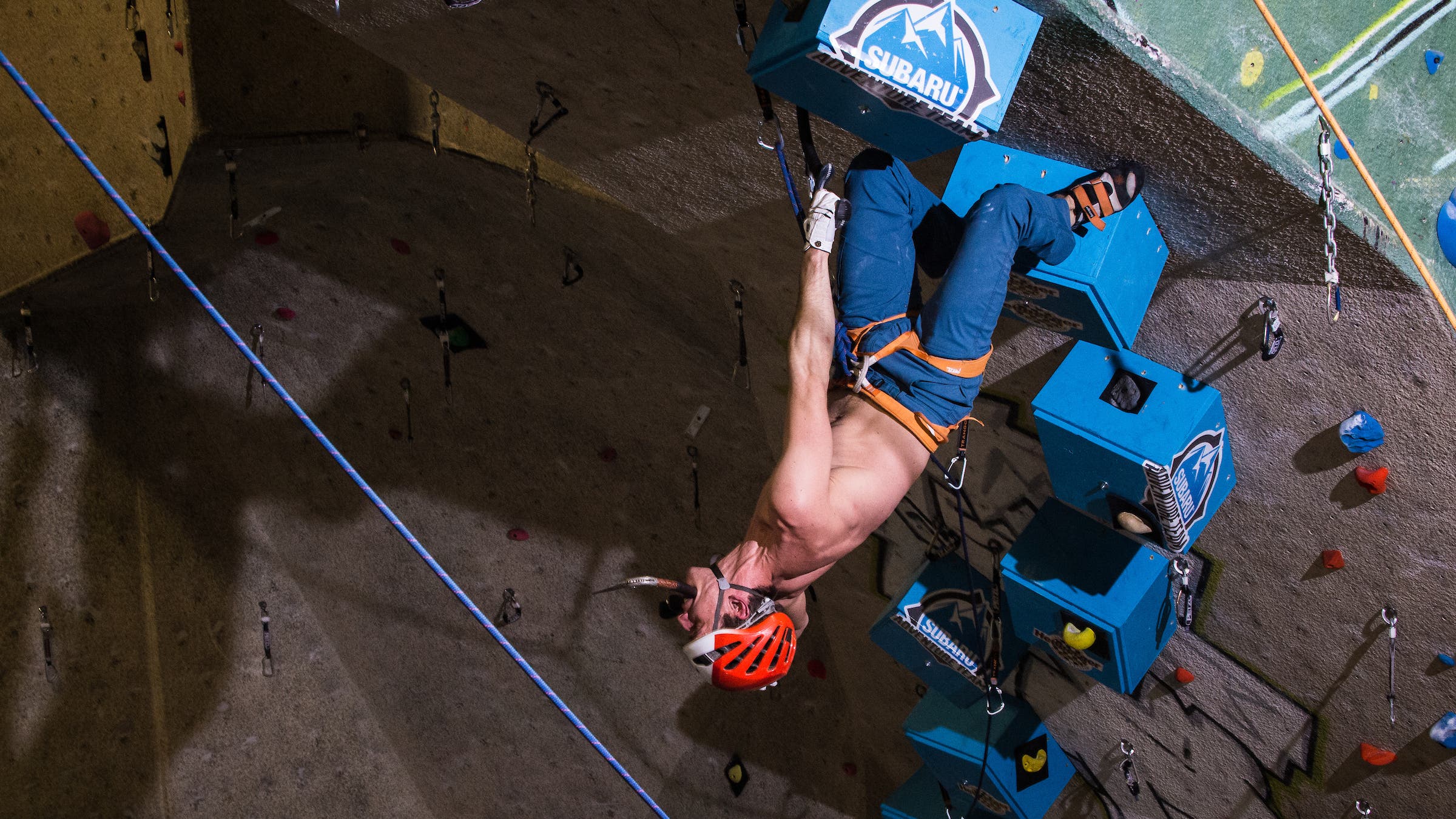 A climber grabs a rest during the finals route at the CityROCK Ice Night.