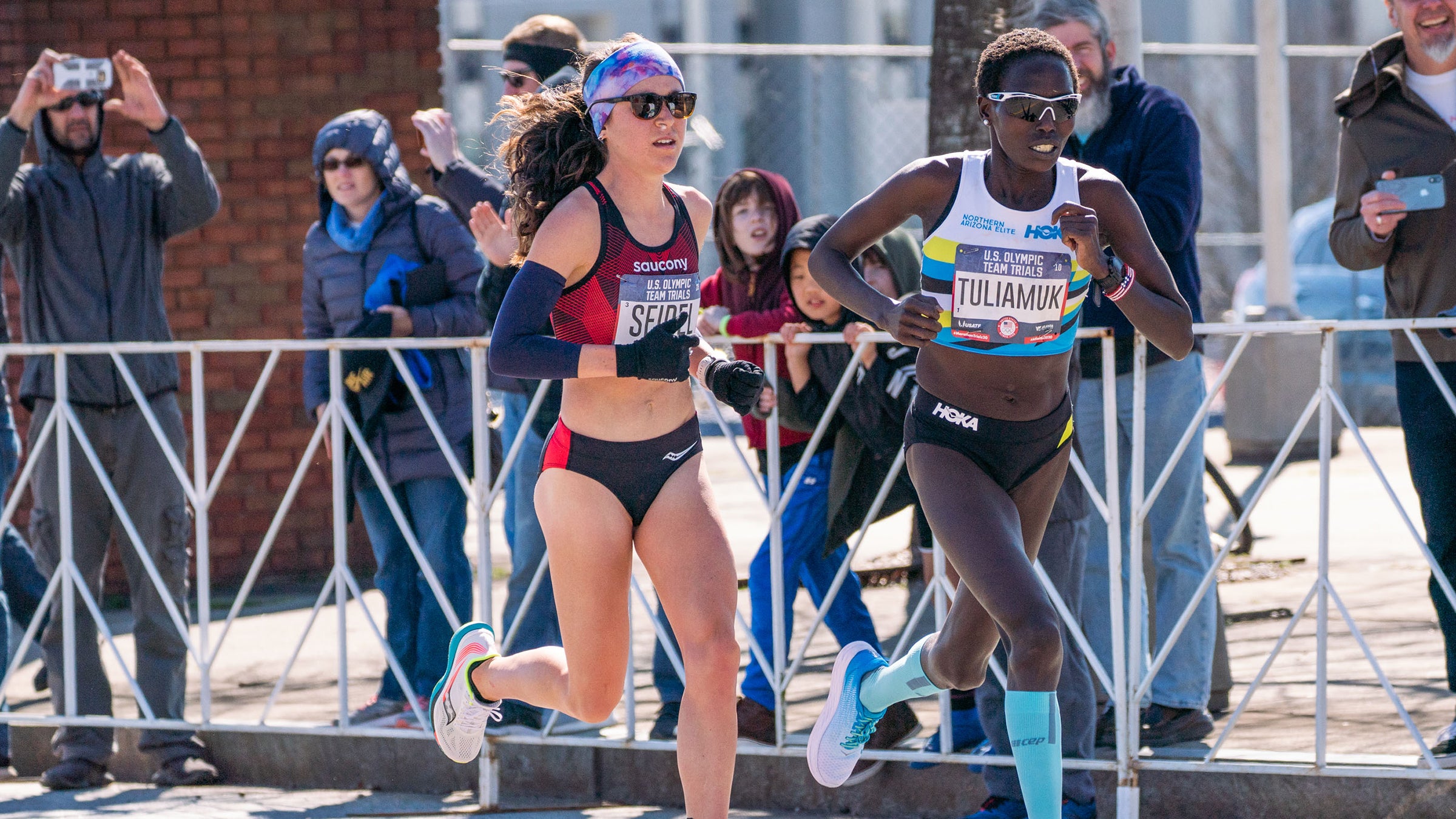 Aliphine Tuliamuk and Molly Seidel worked together over the final six miles, and finished within seven seconds of each other.