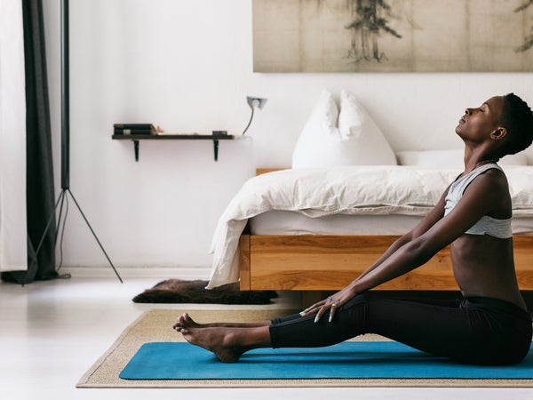 Pretty Black Woman Doing Yoga In Beautiful Home