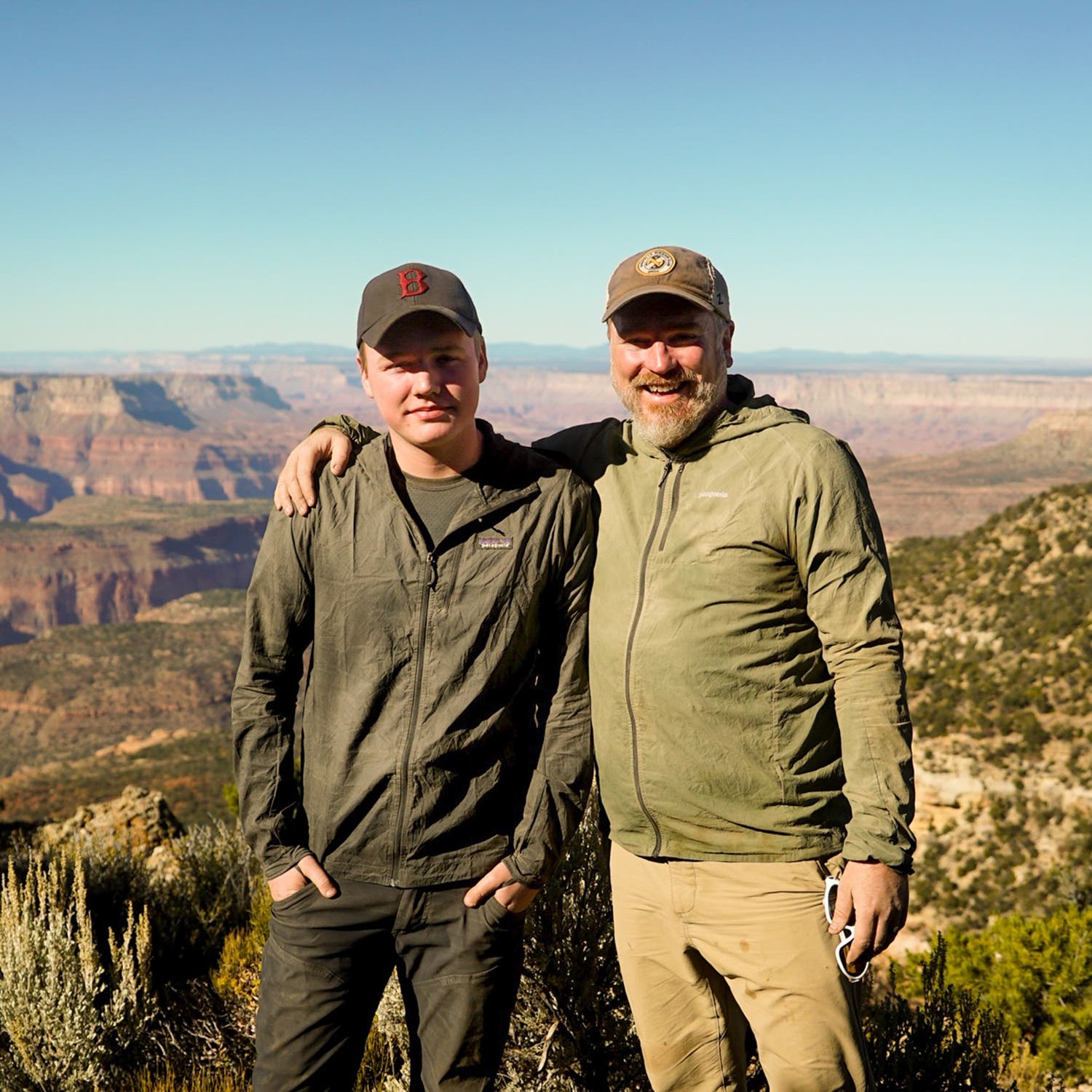 Psychotherapist James (with his son, Elijah) brings clients on Wilderness Collective trips to help foster “wholehearted” men.