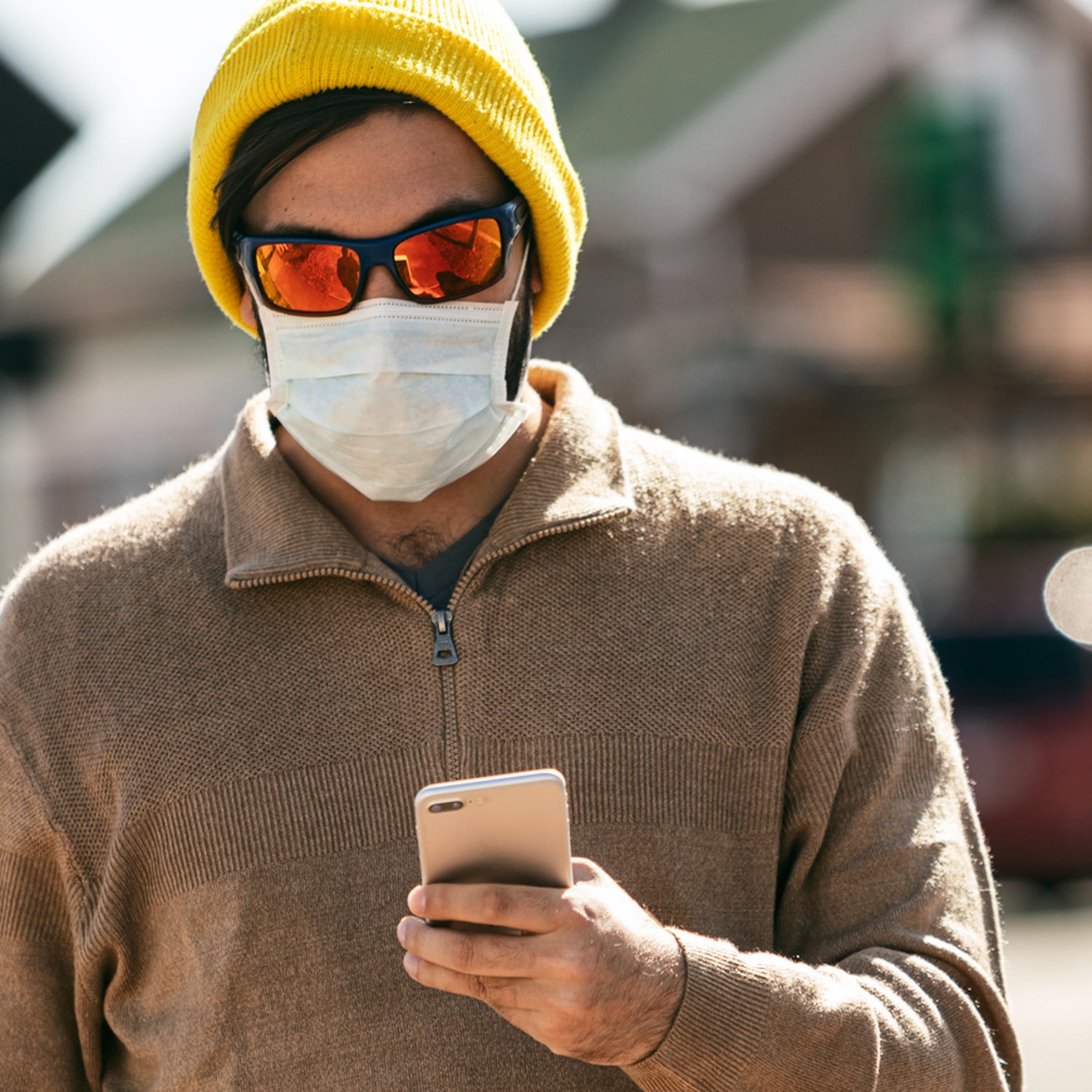 Virus: Hipster Man Walks While Wearing Mask And Using Cell Phone