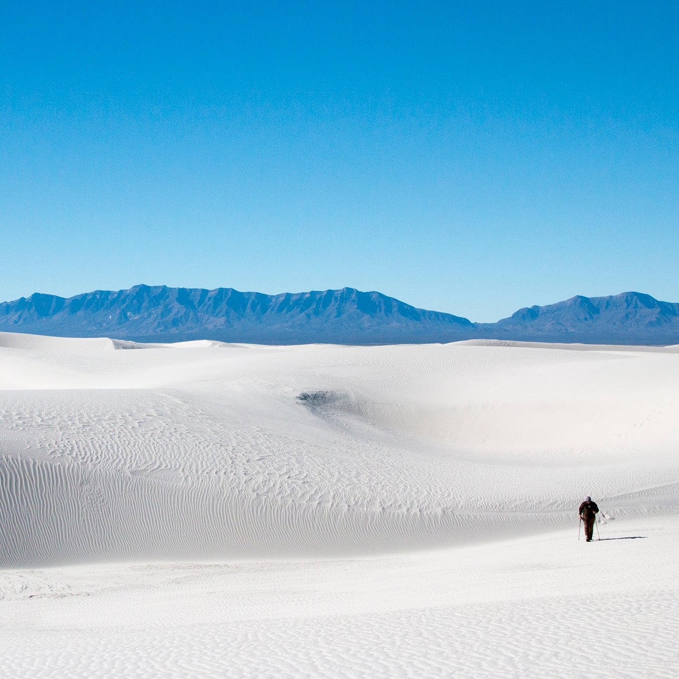 Two hikers in White Sands National Monument.