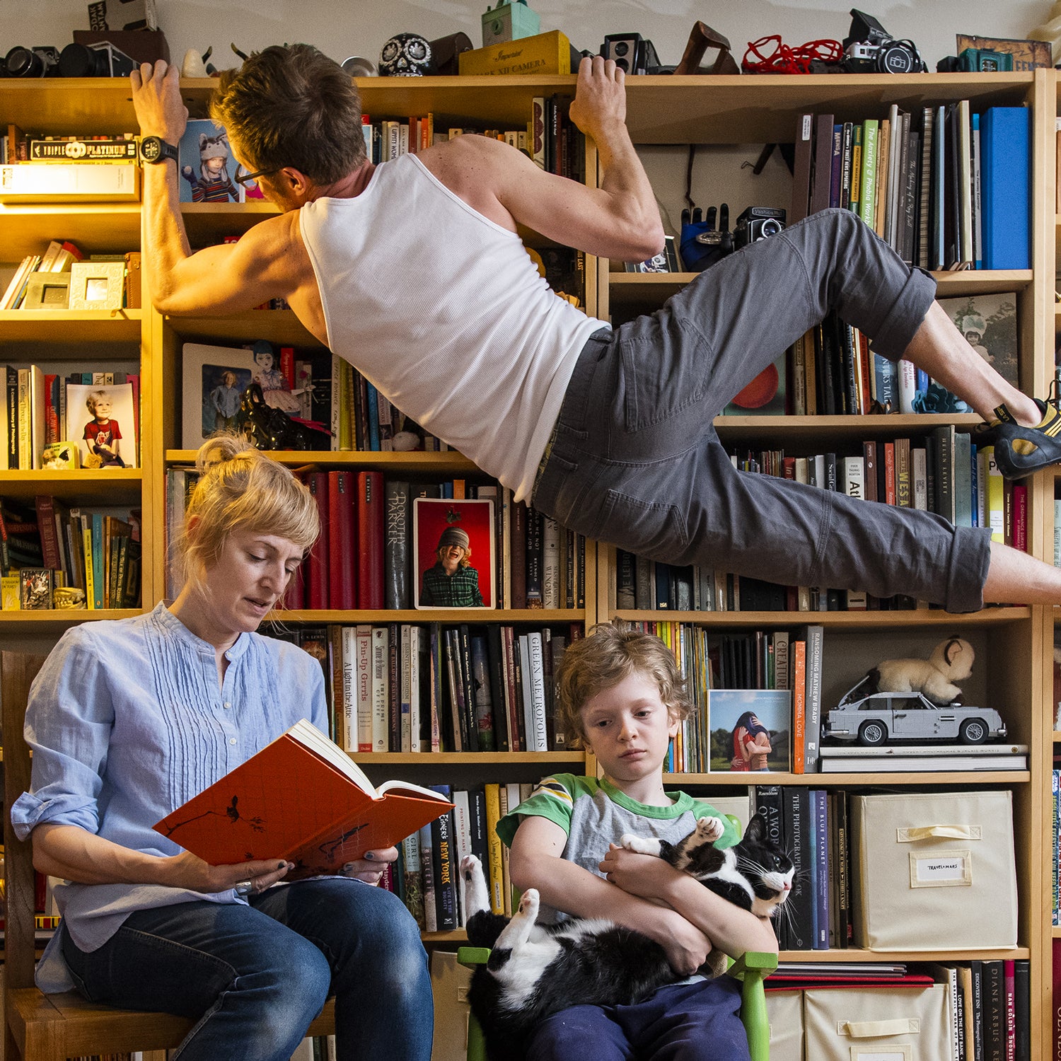Ali and Harper read To Kill A Mockingbird as part of their homeschooling curriculum. Photographer Joshua Bright, who has a pre-existing heart condition carries on climbing during isolation at home inside the one bedroom apartment he shares with his wife and 10-yr-old son on the Lower East Side of New York City during the Coronavirus pandemic.