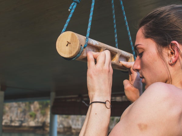 Kyra Condie using a hangboard.
