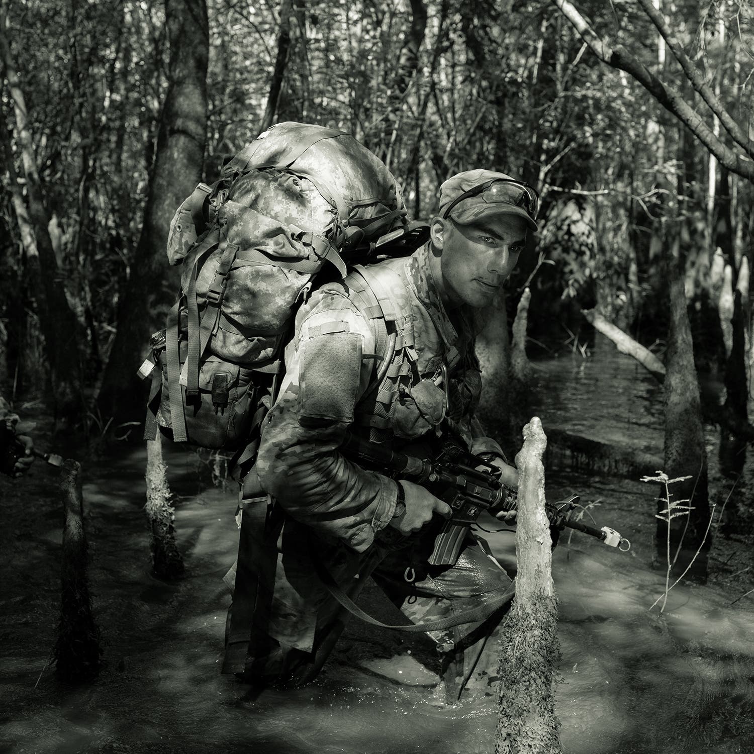 Ranger candidate Jonathan Osborne navigates through the Florida swamps.
