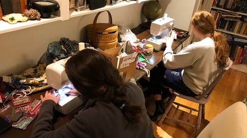 Helen (left) and Anabel Carter sewing masks