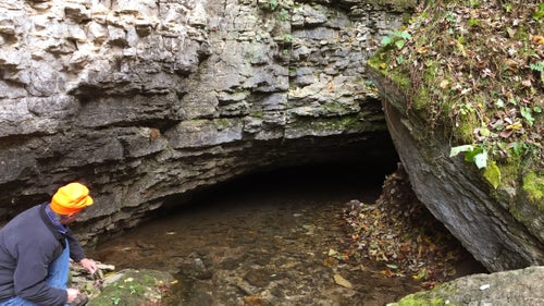 Ackerman at the natural entrance to Tyson Spring Cave