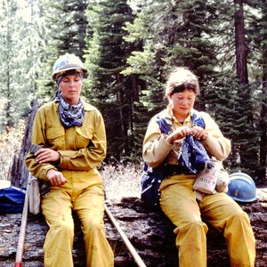 Sue Hasari, right, and Caroline Cavanaugh, left, take a break while working a wildfire in California in 1977. Hasari was the first woman to be hired to Lassen Hotshots in Northern California in 1976, while Cavanaugh was hired the following year.