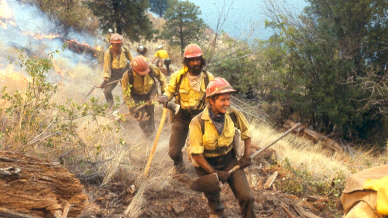 Danah Feldman leads her squad on a fire in the late 1970s while working as a squad boss for the Baker River Hotshots.
