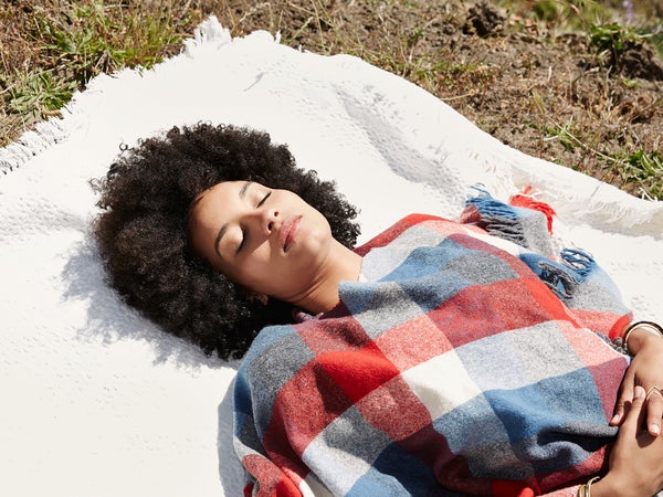 Mixed Race Millennial Woman Sleeping In Nature