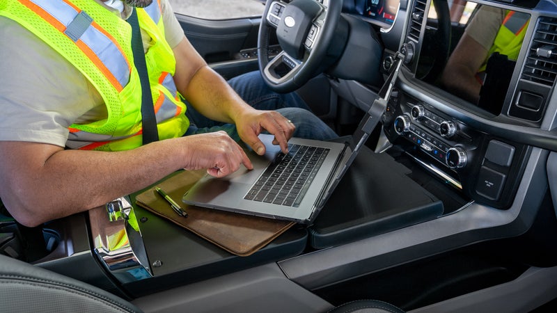 This fold-down table turns the center console into an actual work table, too.