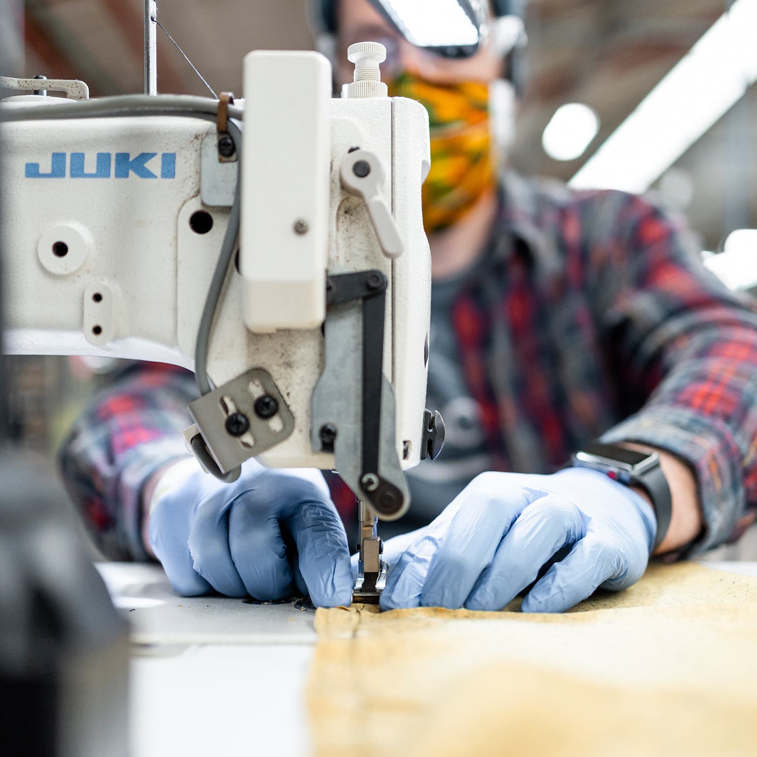 using a sewing machine with latex gloves on