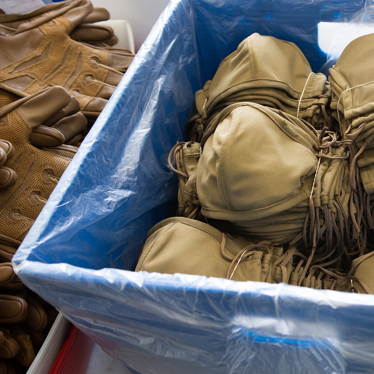 outdoor research masks in a plastic bin
