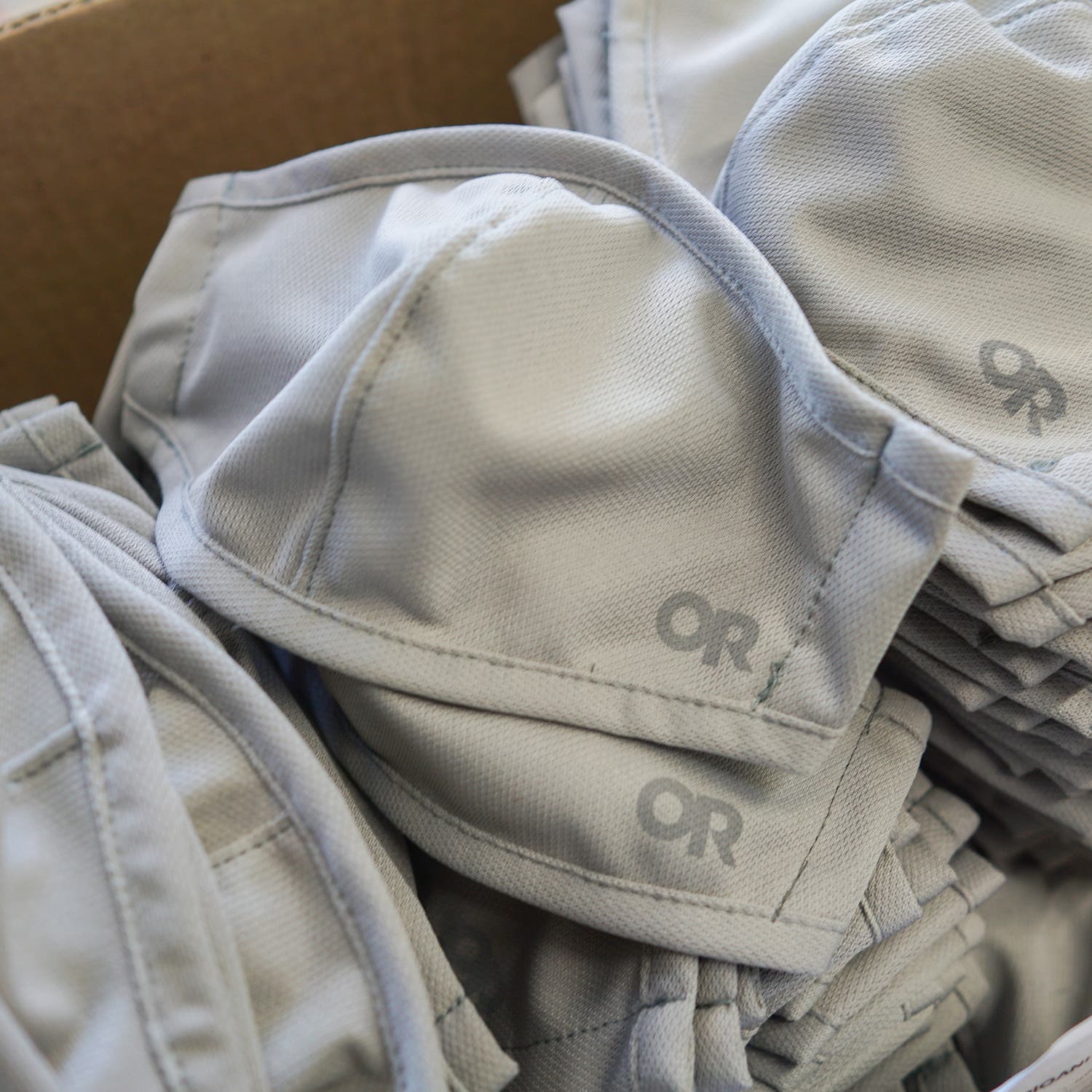 white face masks in a pile