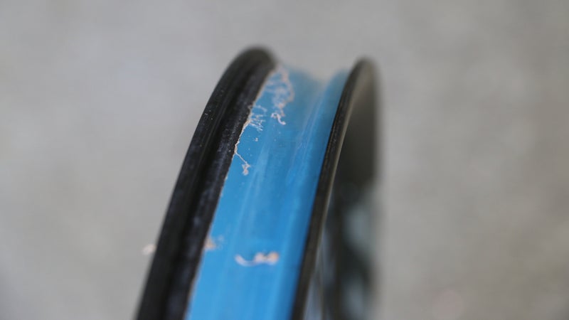 The gunk you see here is old tire sealant. You should wipe down a rim bed so it’s clean.