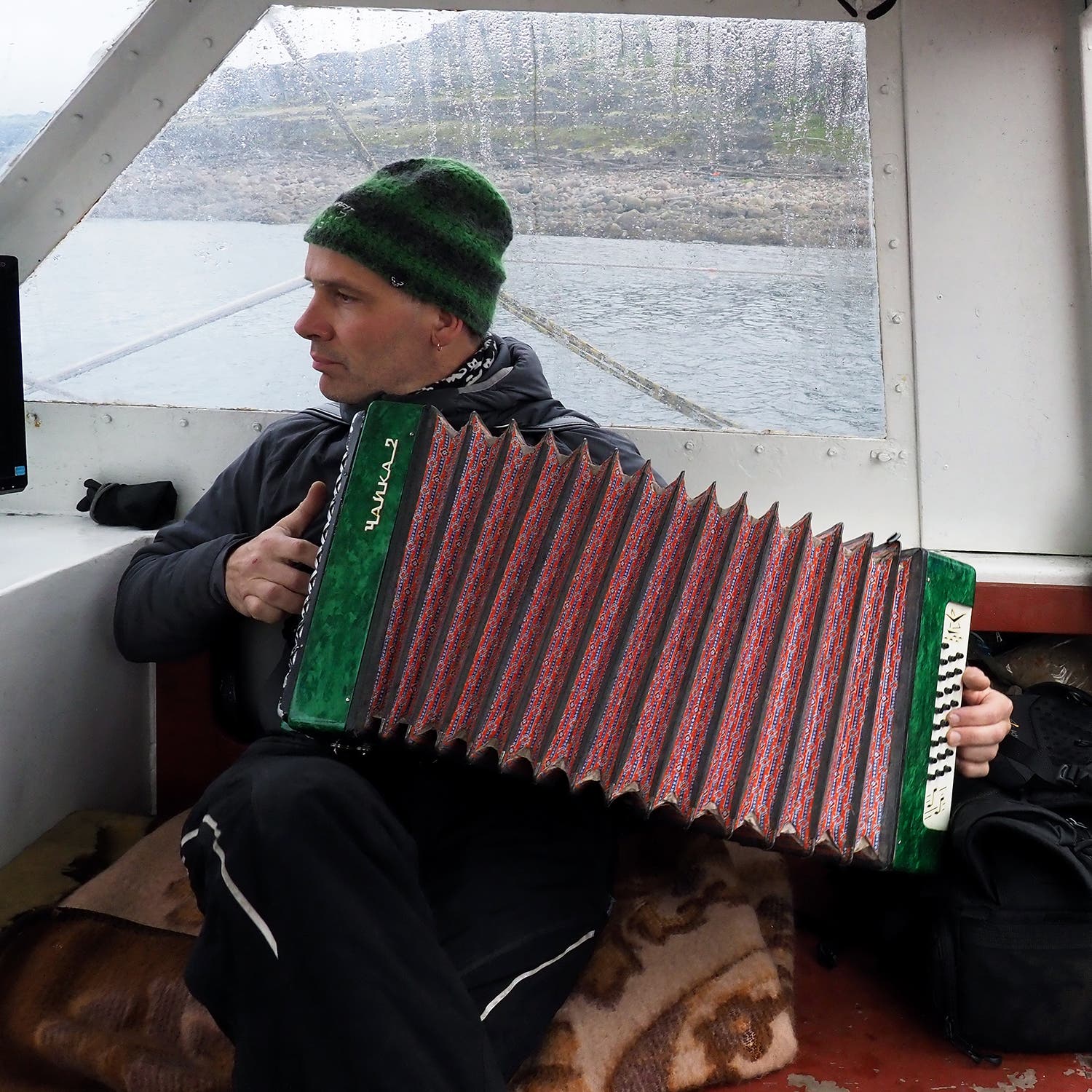 Alexander Bogdanov plays his accordion aboard the <i>Alter Ego</i>.