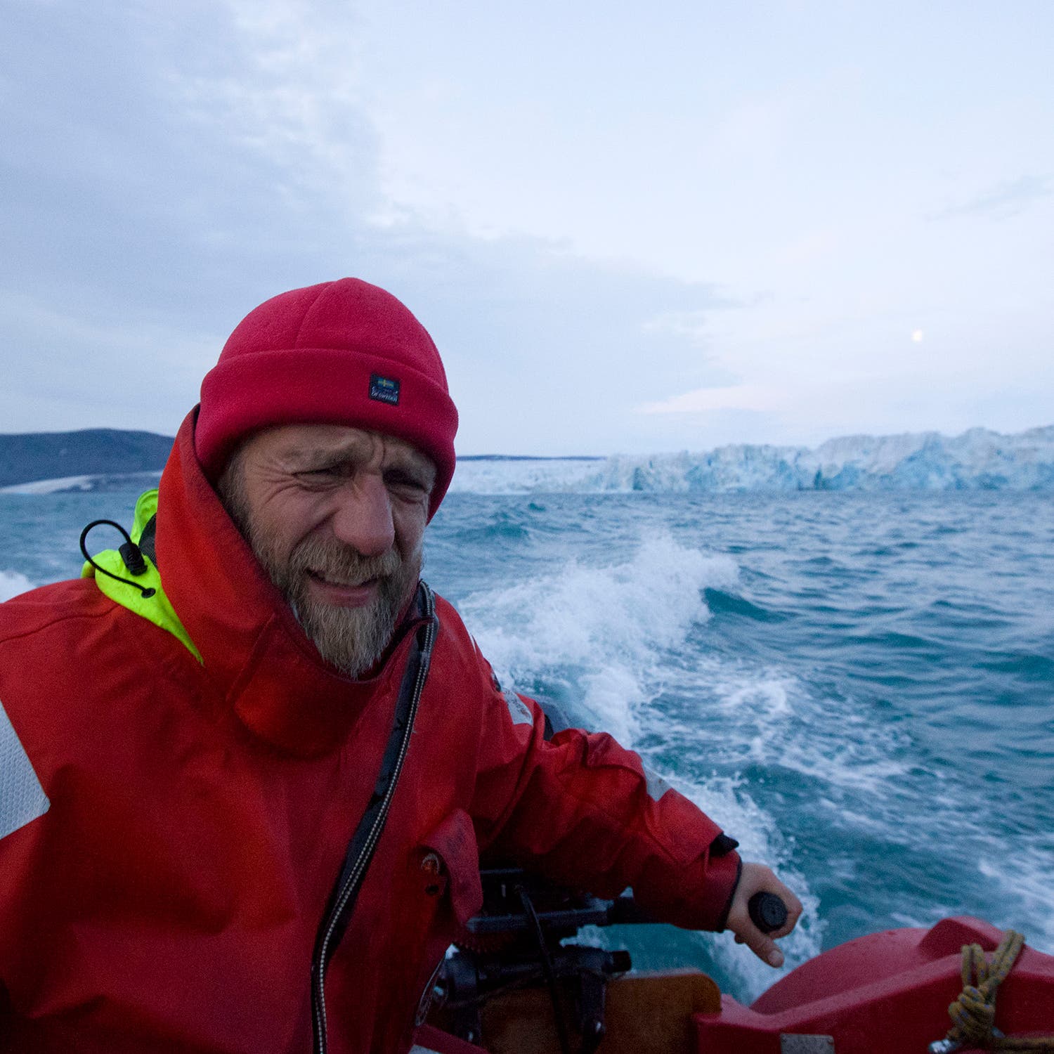 Andrey Ianushkevich steers <i>Mikhalych</i> near the Chaev Glacier.