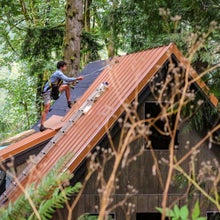 Bryan Schatz on top of the cabin he built with Patrick (Pat) Hutchison in Washington’s Cascade Mountains in 2018