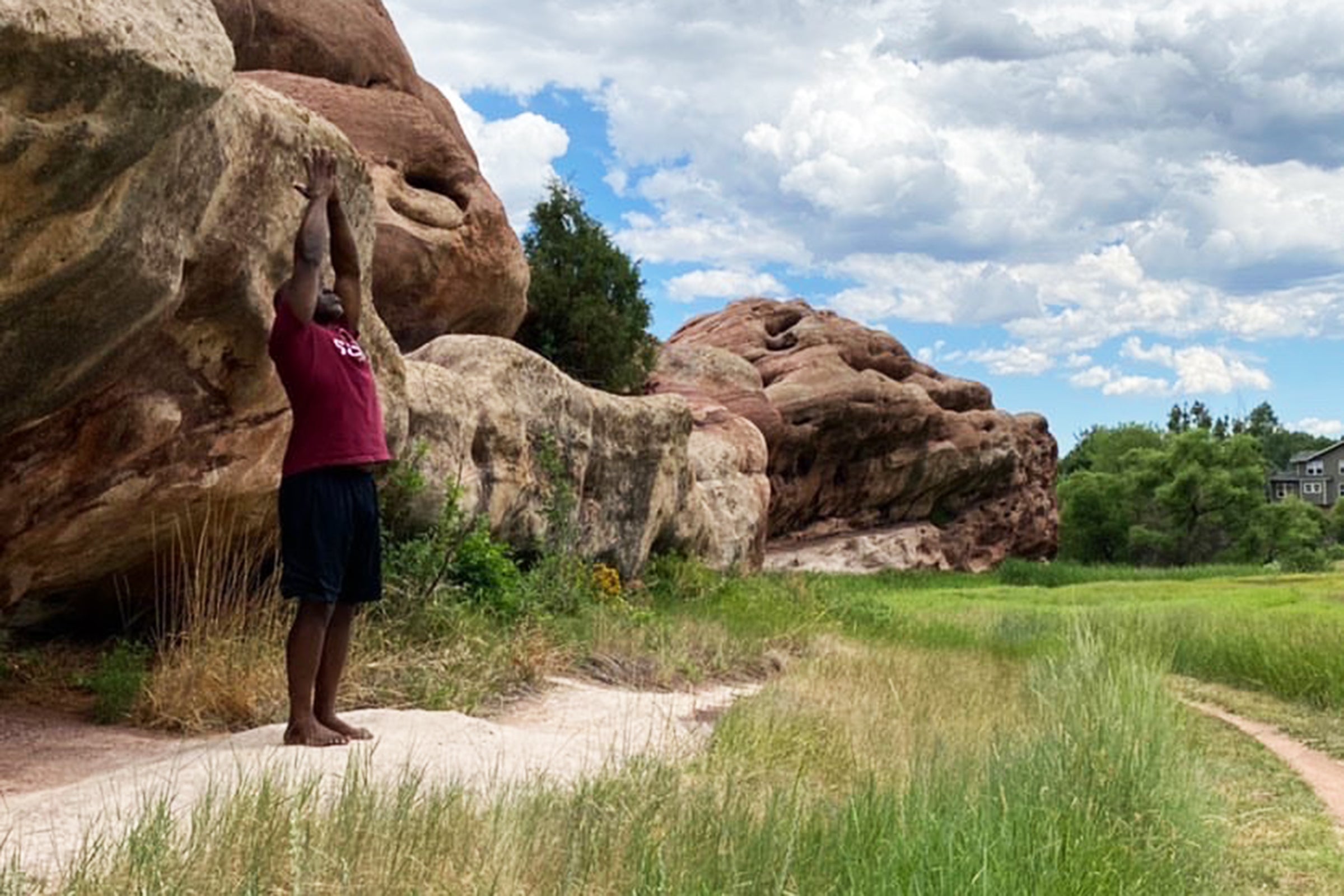 David Hallman demonstrates an asana during a video shoot in Ken Caryl Valley.