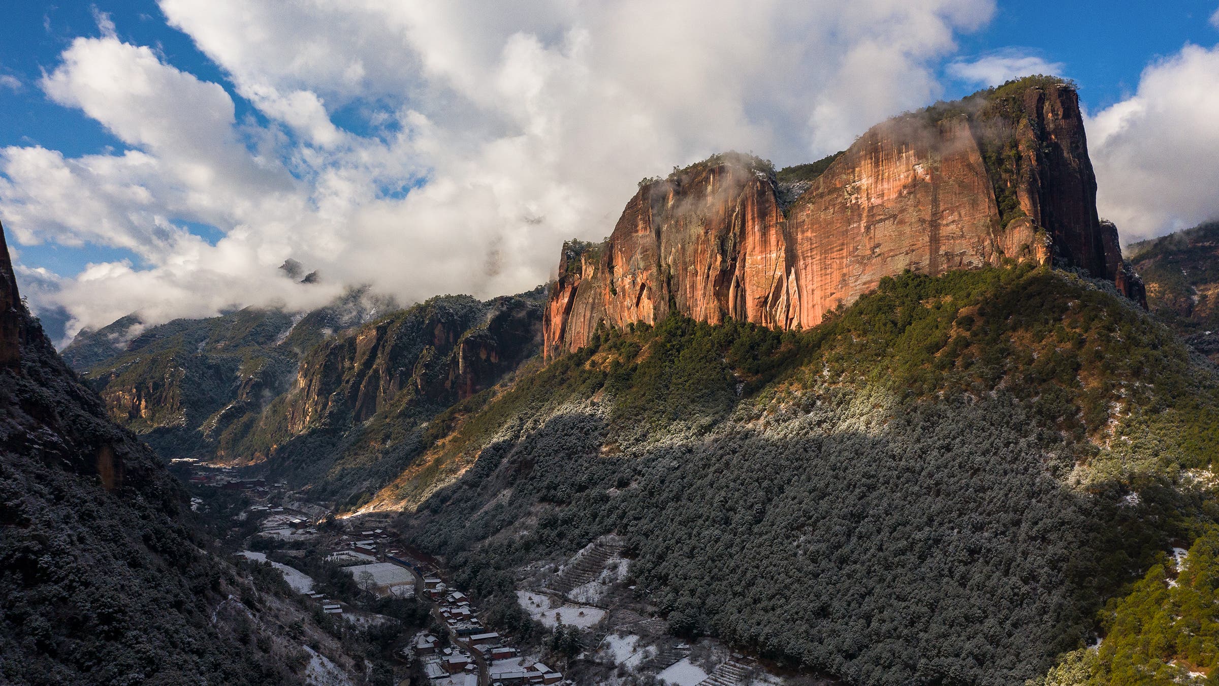 The Dinner Wall looming above the town of Liming